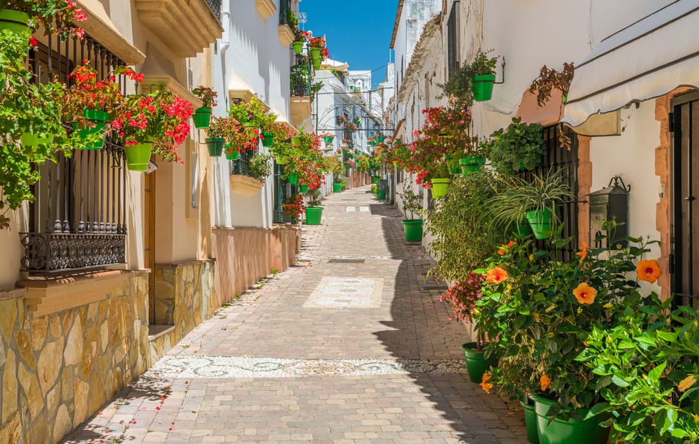 Typical Andalusian streets and balconies with flowers in Andalucia Spain