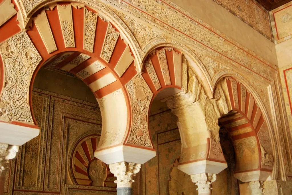 Arches with elaborate plasterwork in the Central nave, Hall of Abd al-Rahman III, Medina Azahara (Madinat al-Zahra), Near Cordoba, Cordoba Province, Andalucia, Spain, Western Europe.