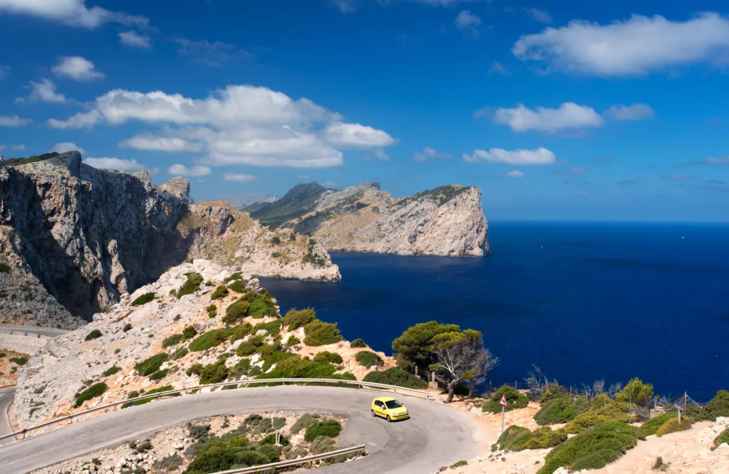 Car at Formentor headland from the cape viewpoint, Mallorca, Spain