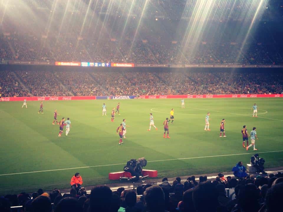 Vibrant atmosphere at the FC Barcelona stadium, Camp Nou, as fans cheer on their beloved team, creating an electrifying sporting experience.