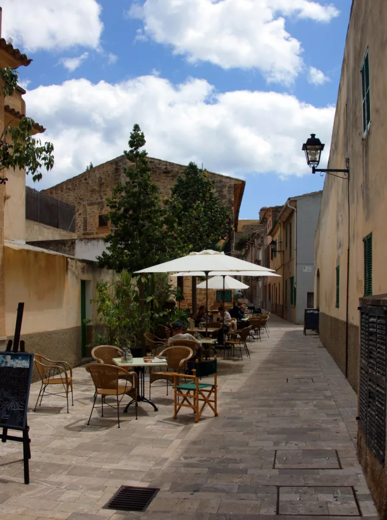 A picturesque village nestled in the breathtaking mountains of Mallorca, Spain. The village of Deia captivates with its traditional architecture, terracotta roofs, and lush greenery