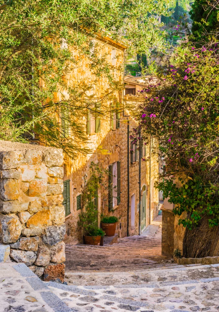 Charming street in Deia, a picturesque village in Mallorca, Spain