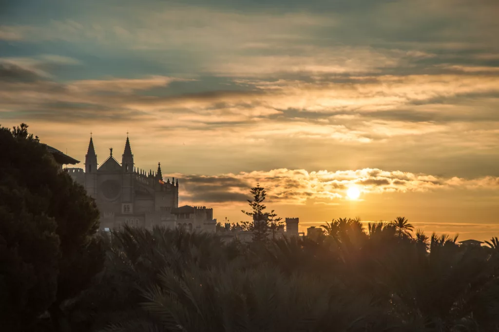 A picture of the Cathedral of Mallorca and the Harbour of Palma during Sunrise in the Winter