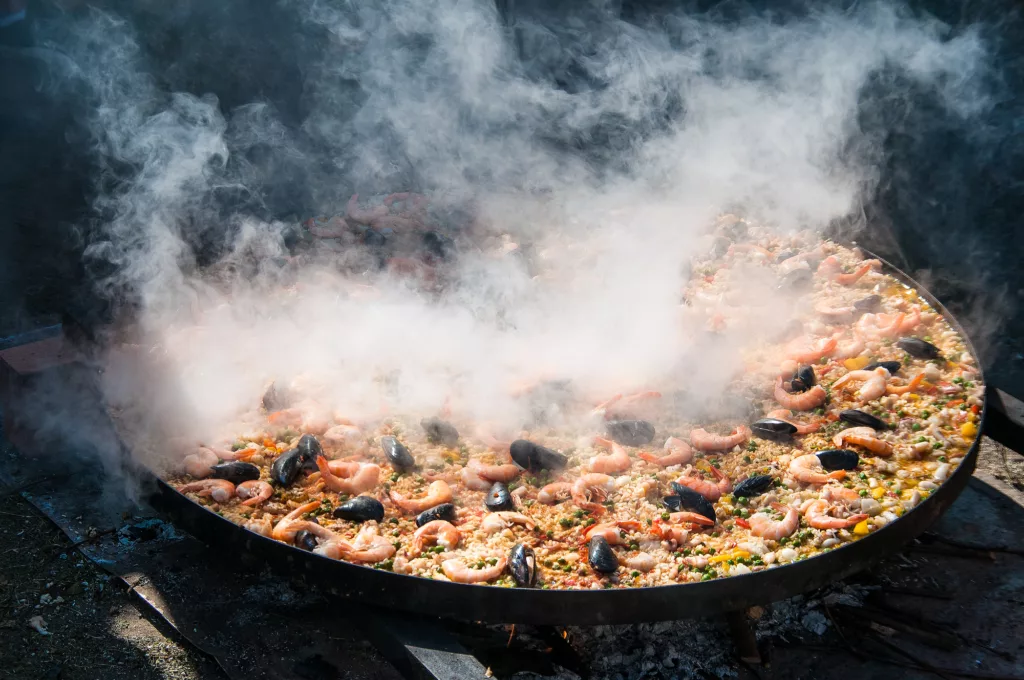 Cooking paella in large pot