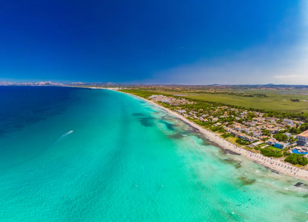 Aerial drone view of a coastline with beach in Playa de Muro, Mallorca, Spain