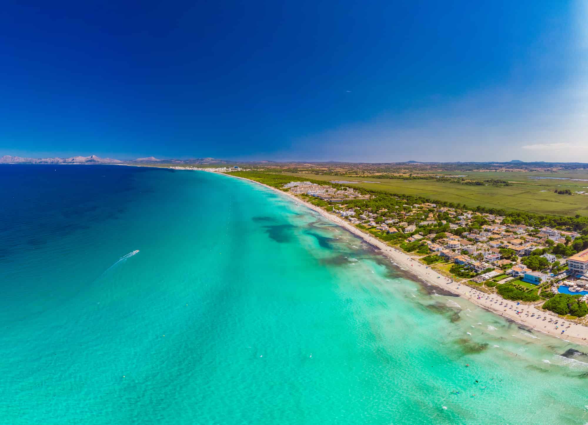 Aerial drone view of a coastline with beach in Playa de Muro, Mallorca, Spain