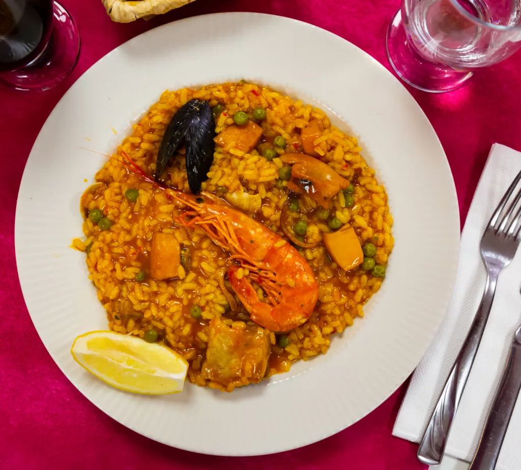 Spainsh dish seafood paella with rice, shrimps and mussels