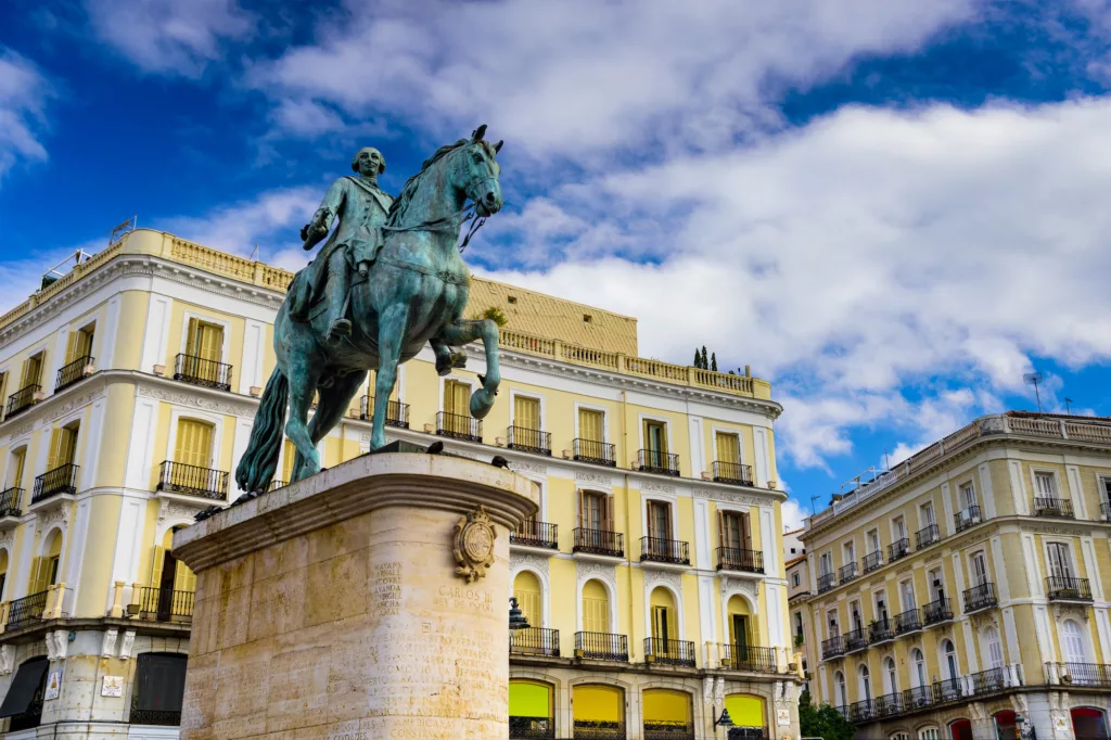 Madrid, Spain at the King Charles III equestrian statue in Puerta del Sol.