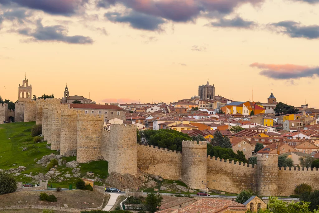 Walls of Medieval city of Avila at sunset