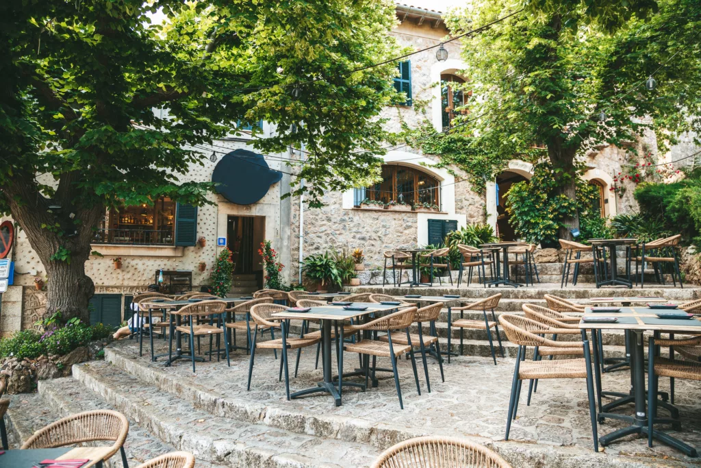 Cozy outdoor cafe or restaurant in famous village Valldemossa, Mallorca