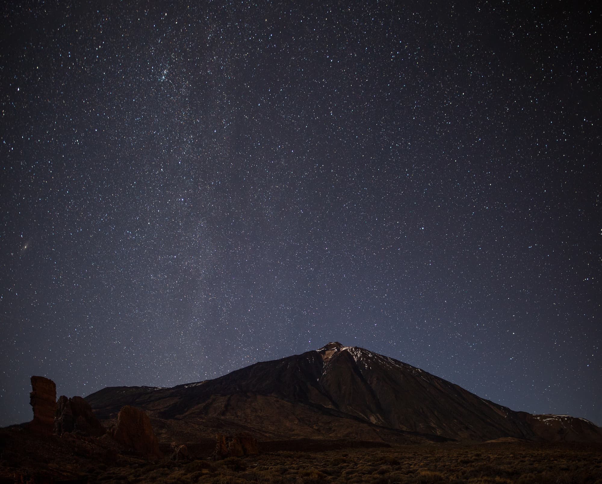 Night sky with shiny stars above volcano El Teide. Milky Way. Night in the Teide National Park, Tenerife, Canary Islands