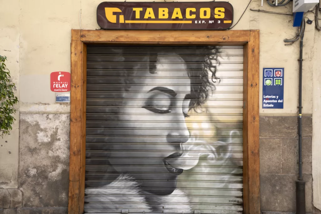 Smoking girl graffiti in valencia spain