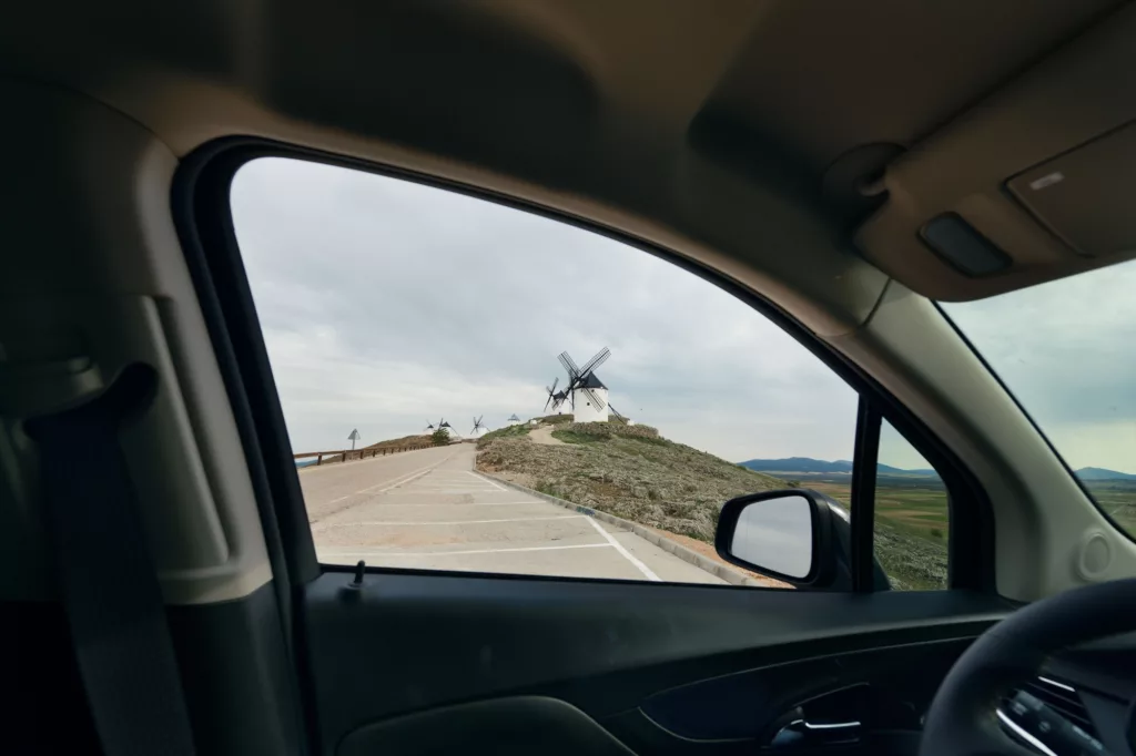 Windmill viewed from car in Consuegra near Toledo in Spain
