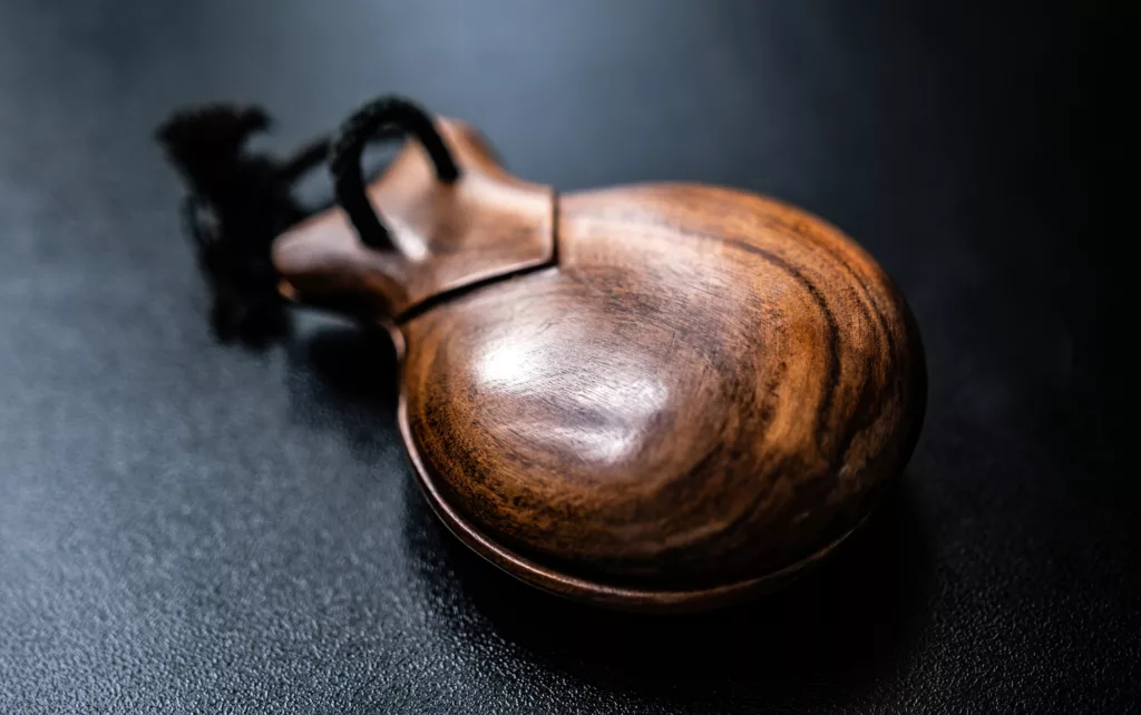 Wooden castanet for flamenco dance closeup. Traditional hispanic musical instrument for live perfomance