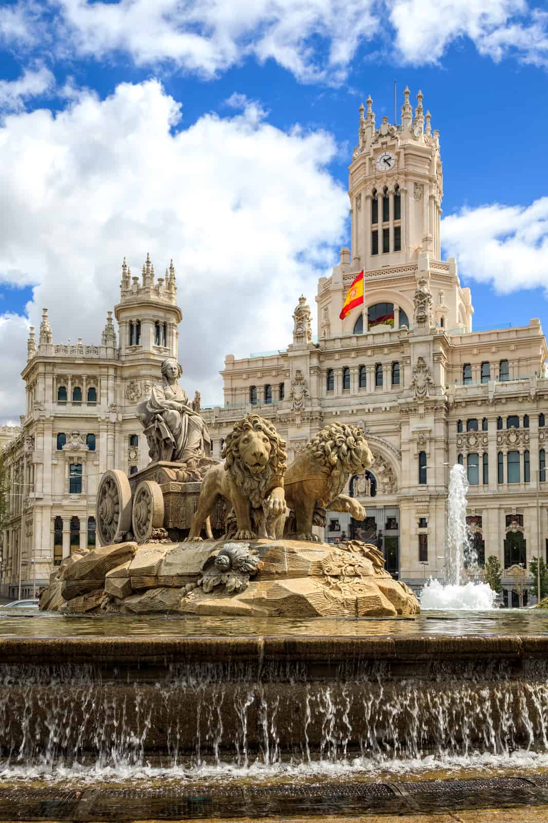 Cibeles fountain at Plaza de Cibeles in Madrid in a beautiful summer day