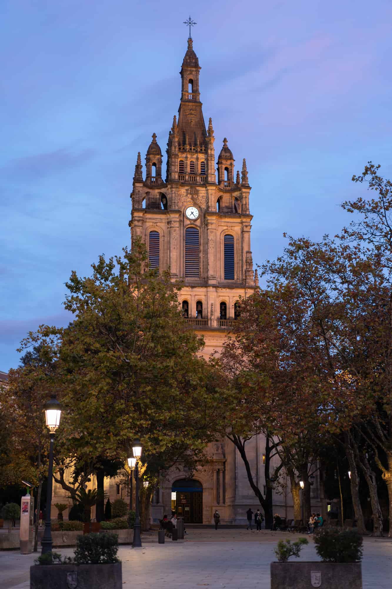 A vertical shot of the basilica of Begona against a blue sky in the evening in Bilbao, Spain