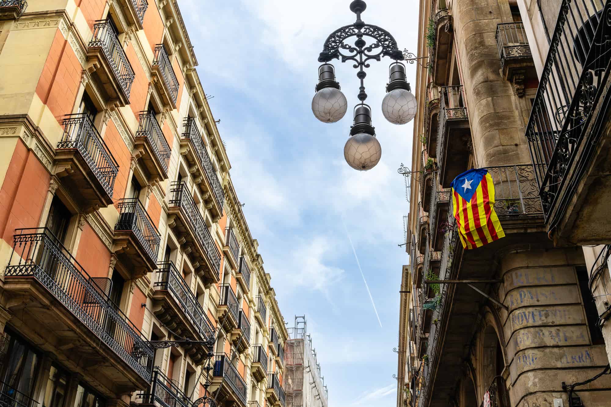 Barcelona street with a pro-independence flag