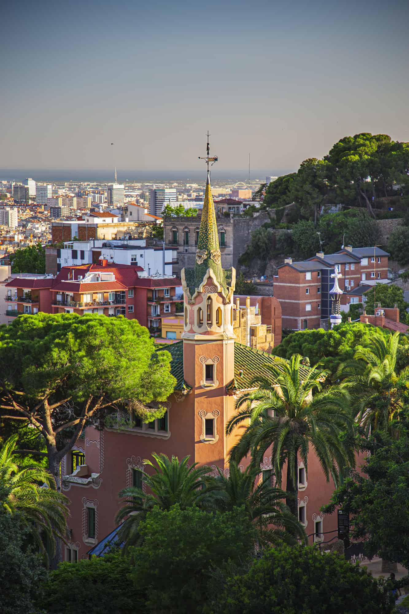 Gaudi house church at sunset, with Barcelona as a background