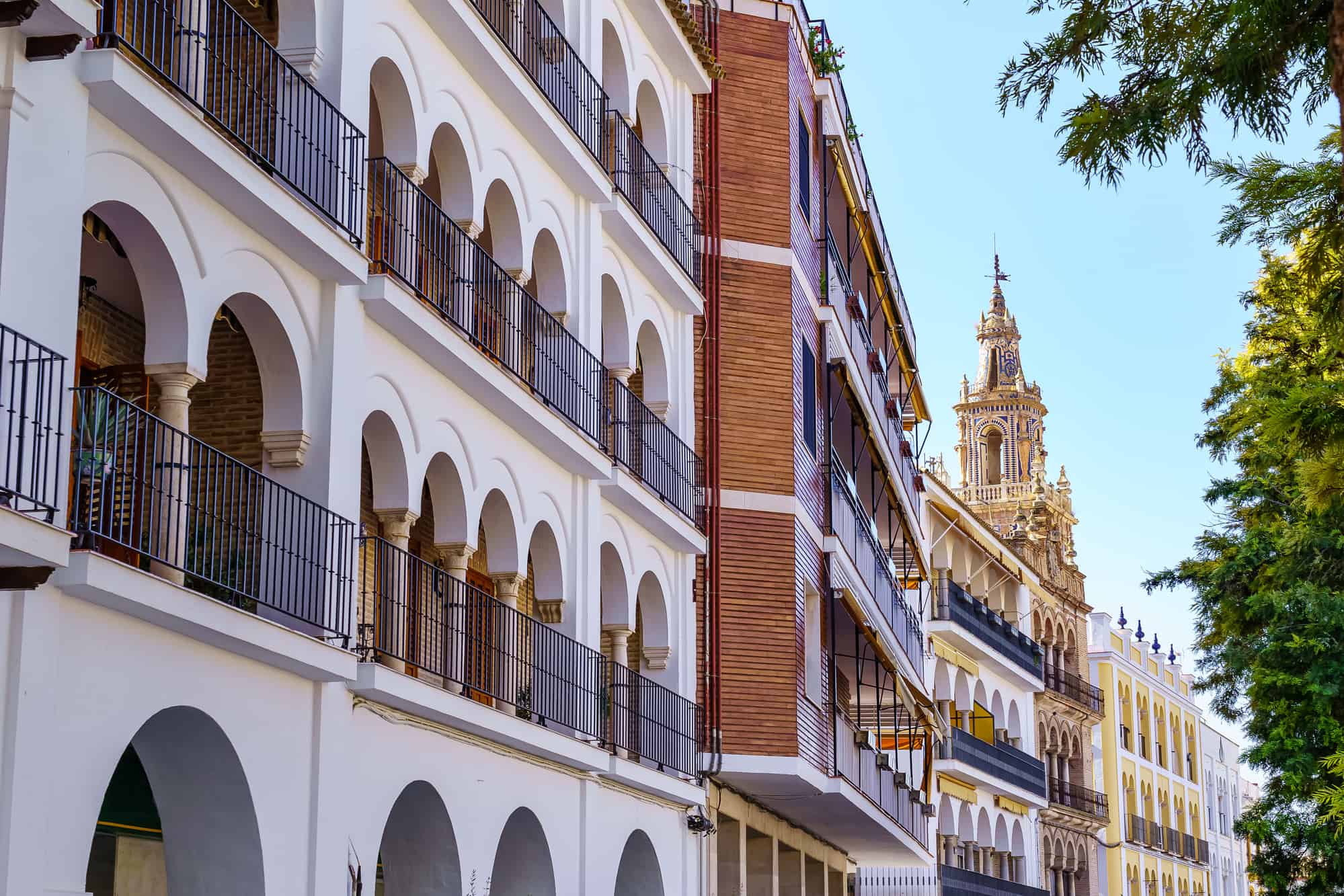 Picturesque buildings with medieval church tower, Seville