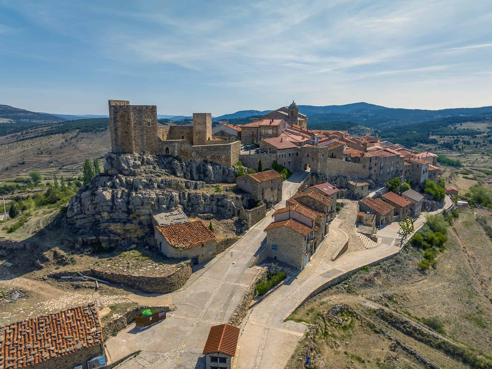 Puertomingalvo province of Teruel listed as beautiful towns of Spain Front panoramic aerial view entrance and castle