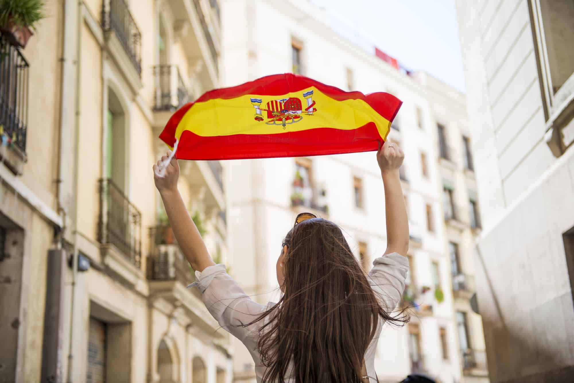 Tourist waving a Spanish flag