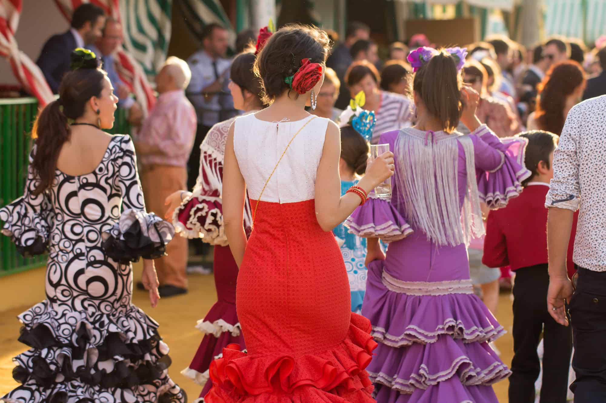 Women dressed in traditional costumes at the Seville's April Fair