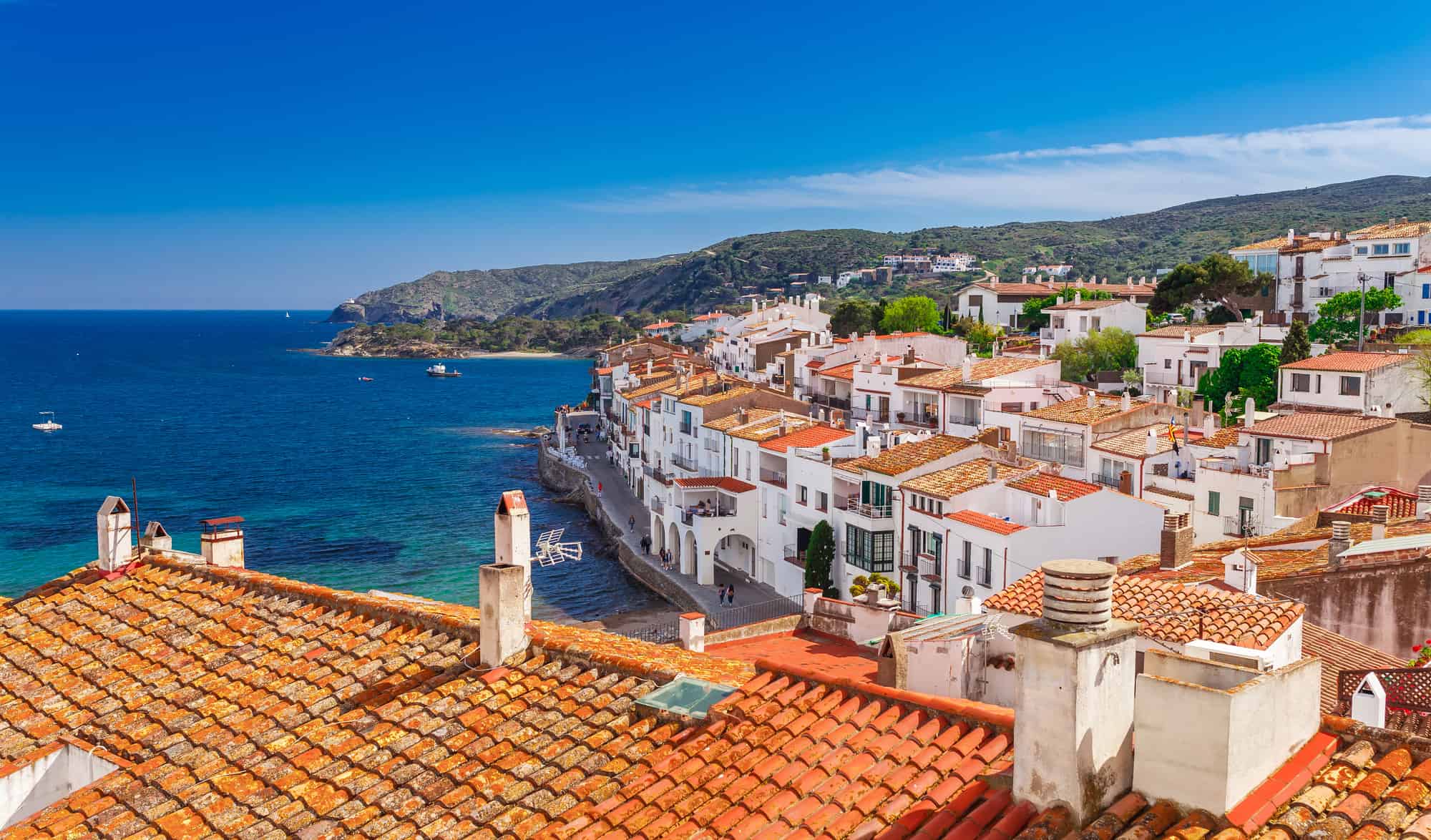 Top view in Cadaques, Catalonia, Spain near of Barcelona. Scenic old town with nice beach and clear blue water in bay. Famous tourist destination in Costa Brava with Salvador Dali landmark