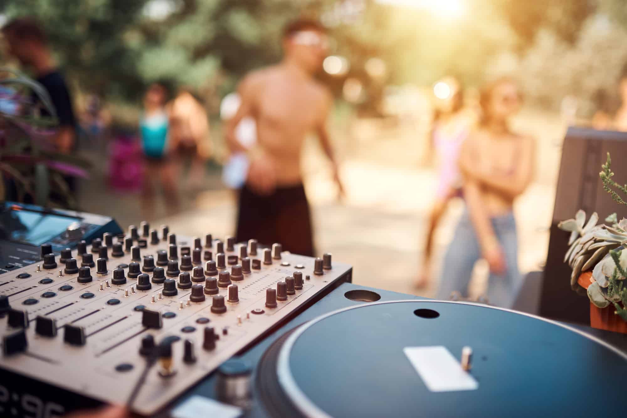 Close up of a DJ playing music on the outdoor party in Marbella, Spain