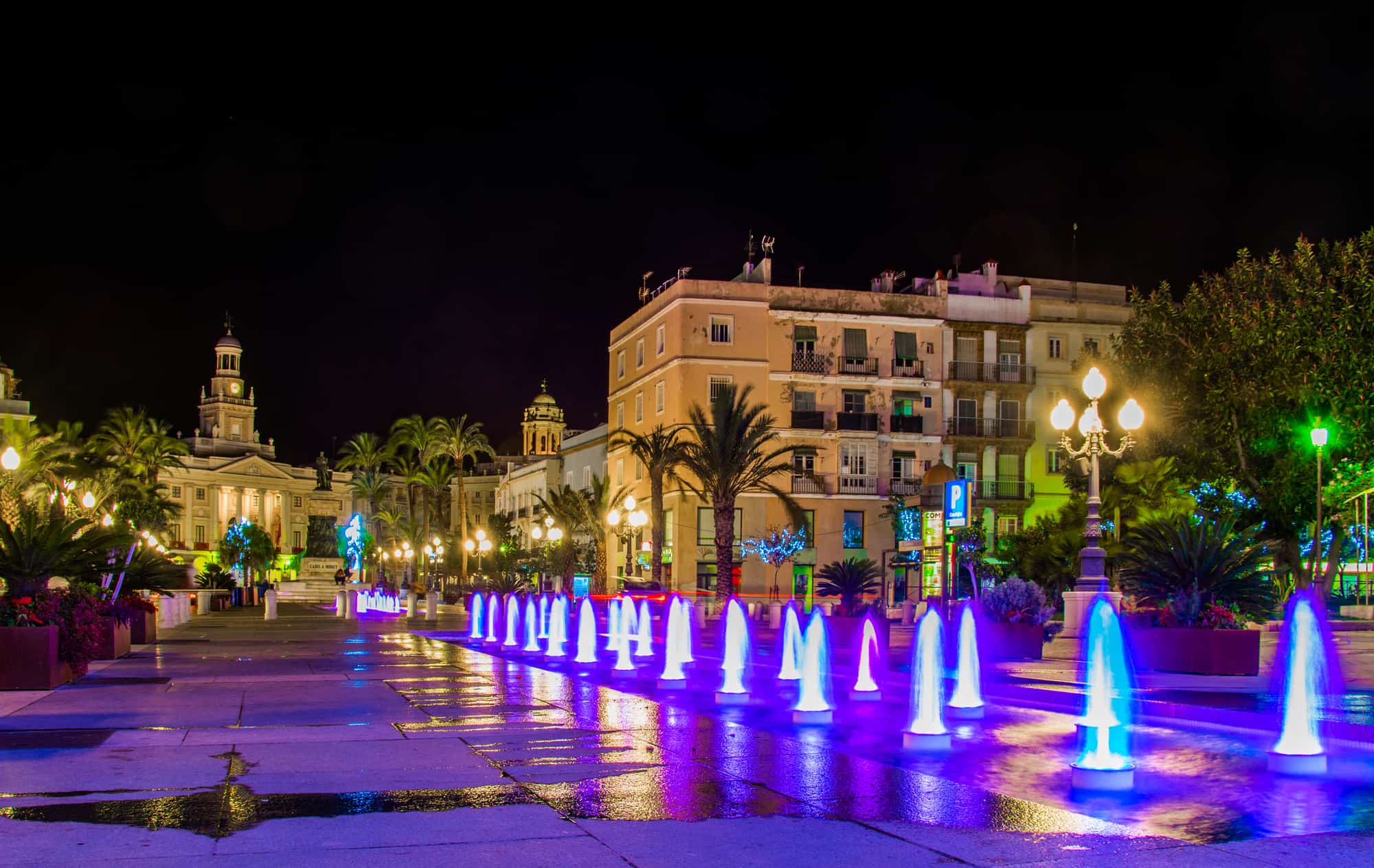Night view of a fountain situated on the square of saint john  in Cadiz