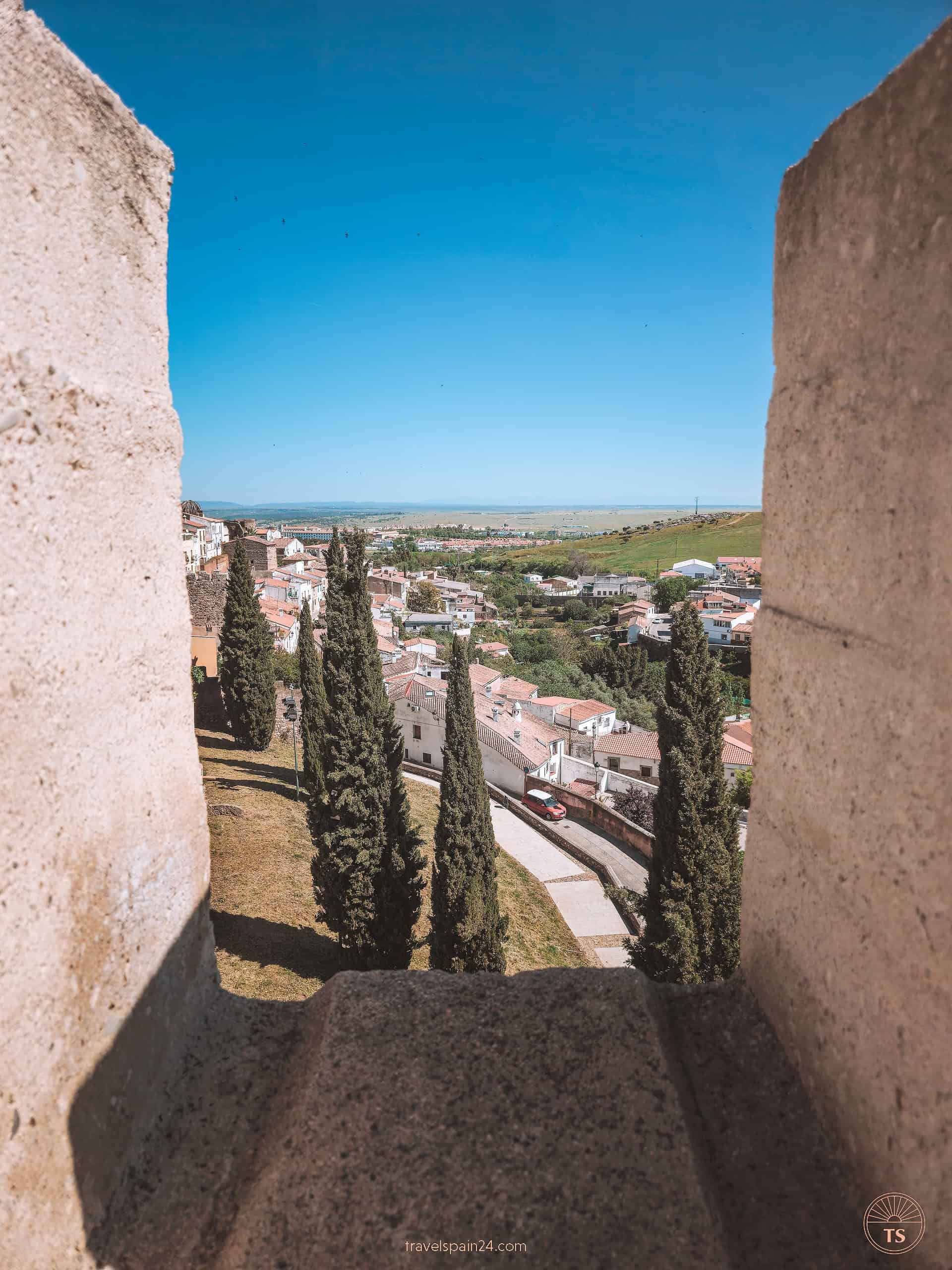 Panoramic view from atop the Baluarte de los Pozos, part of the old Jewish quarter in Cáceres, highlighting the medieval fortifications that once protected the city.