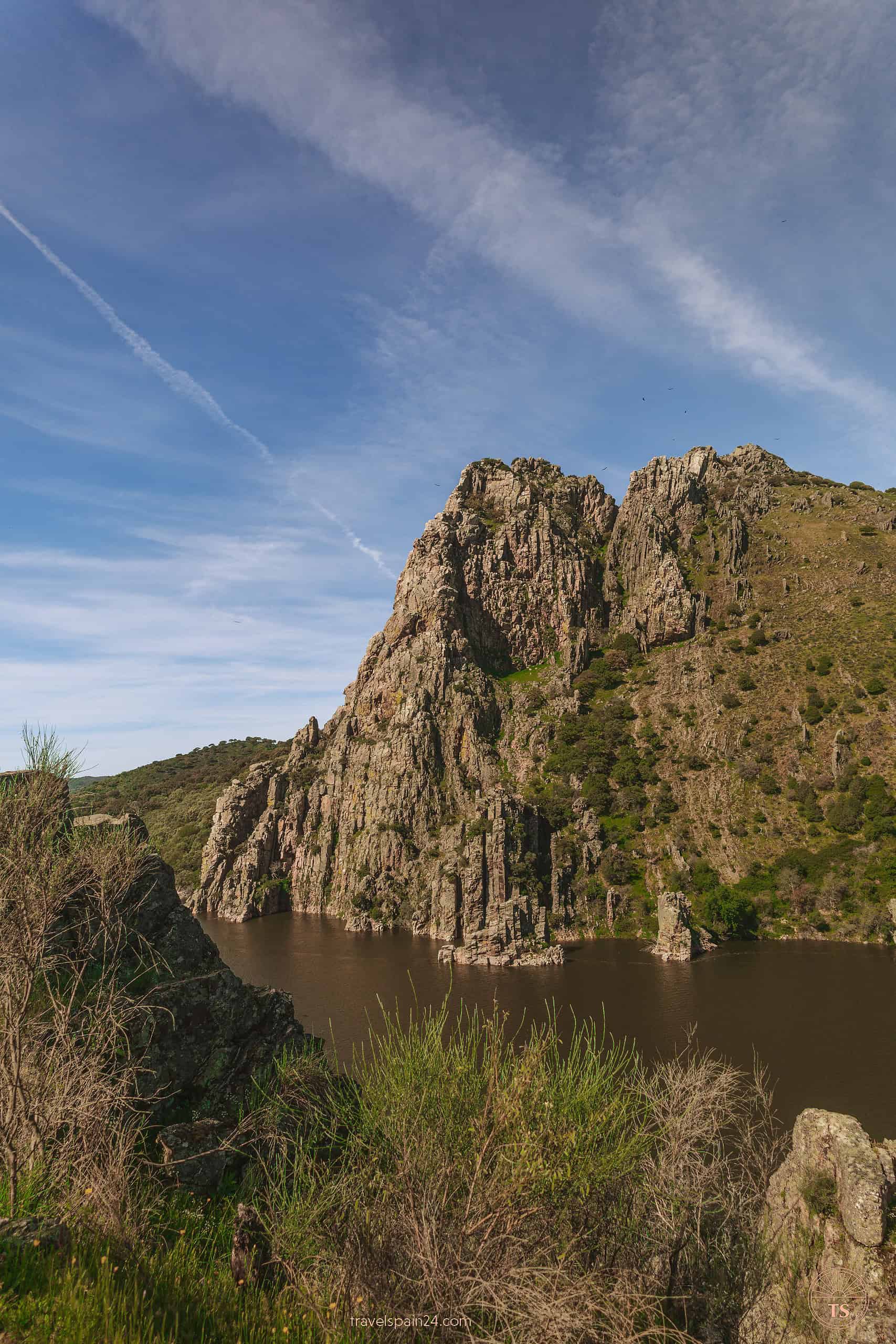 Panoramic view from Salto del Gitano in Monfragüe National Park, featuring the Peña Falcón rock formation and the Tagus River, a popular spot for observing vultures and eagles.
