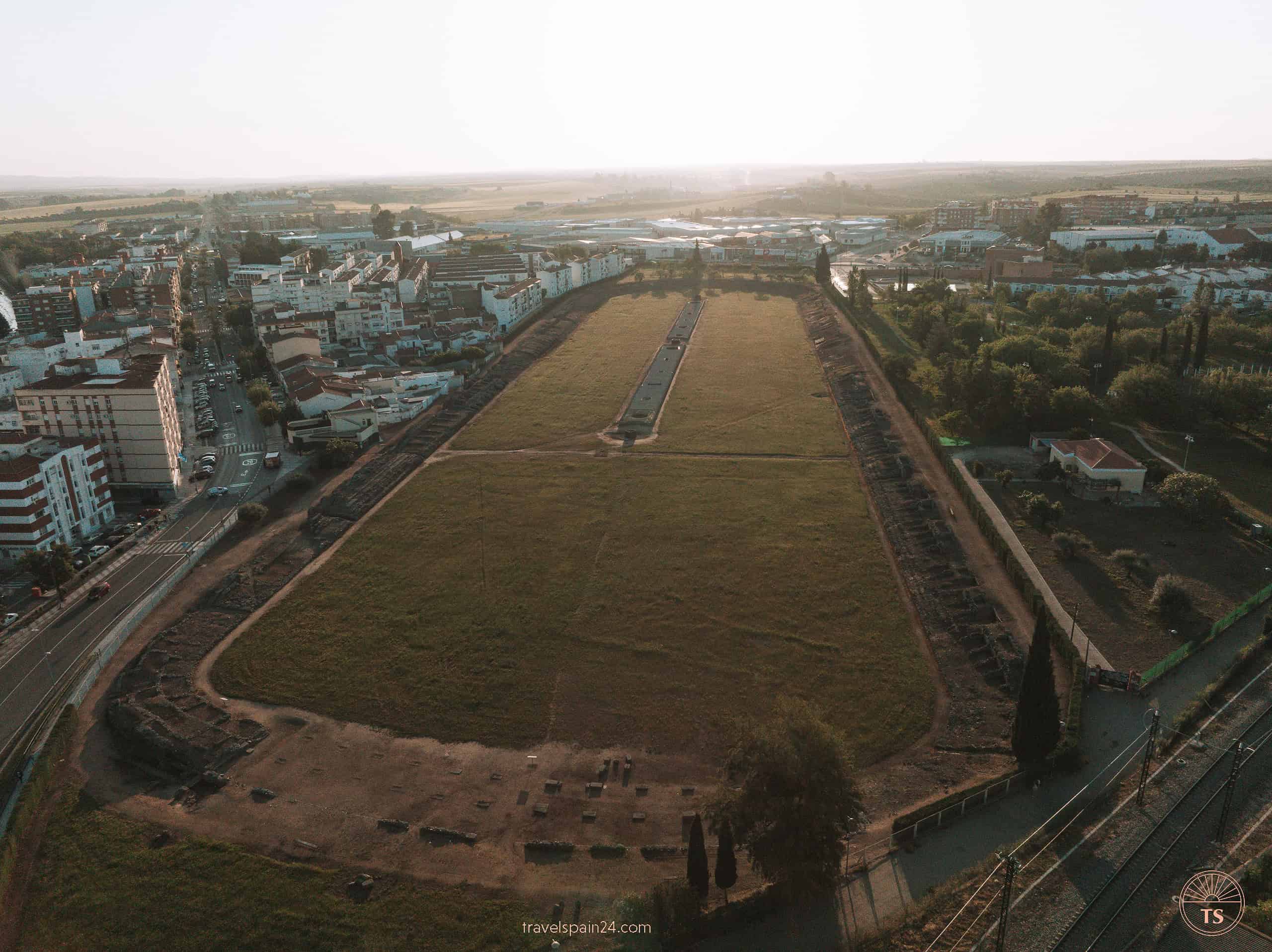 Drone view of the Roman Circus in Mérida, a vast ancient site used for chariot racing, stretching 403 meters long and 96.5 meters wide.