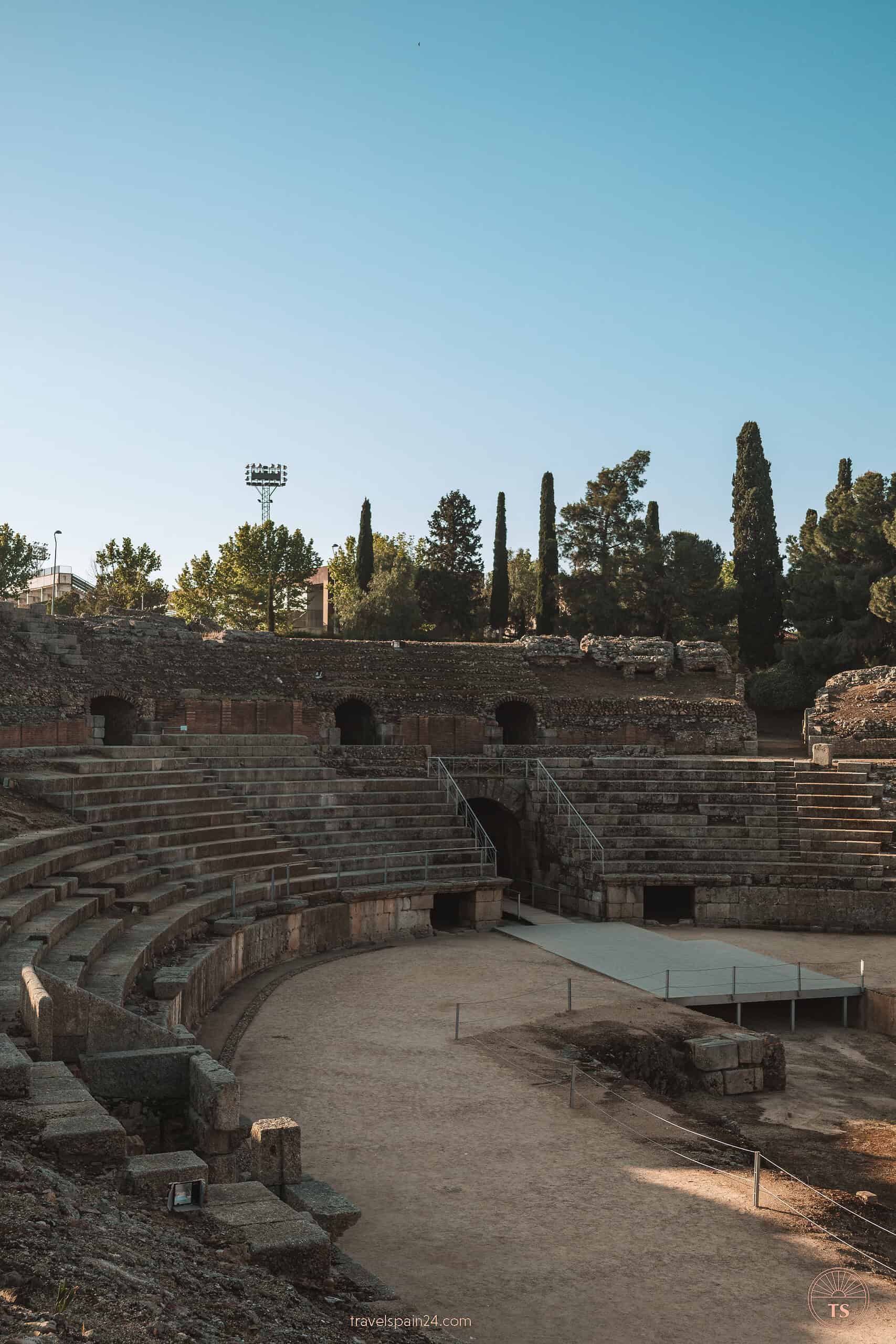 The ancient Roman amphitheater in Mérida, once a venue for gladiator fights, captured in its majestic ruinous state, a testament to the city's rich historical past.