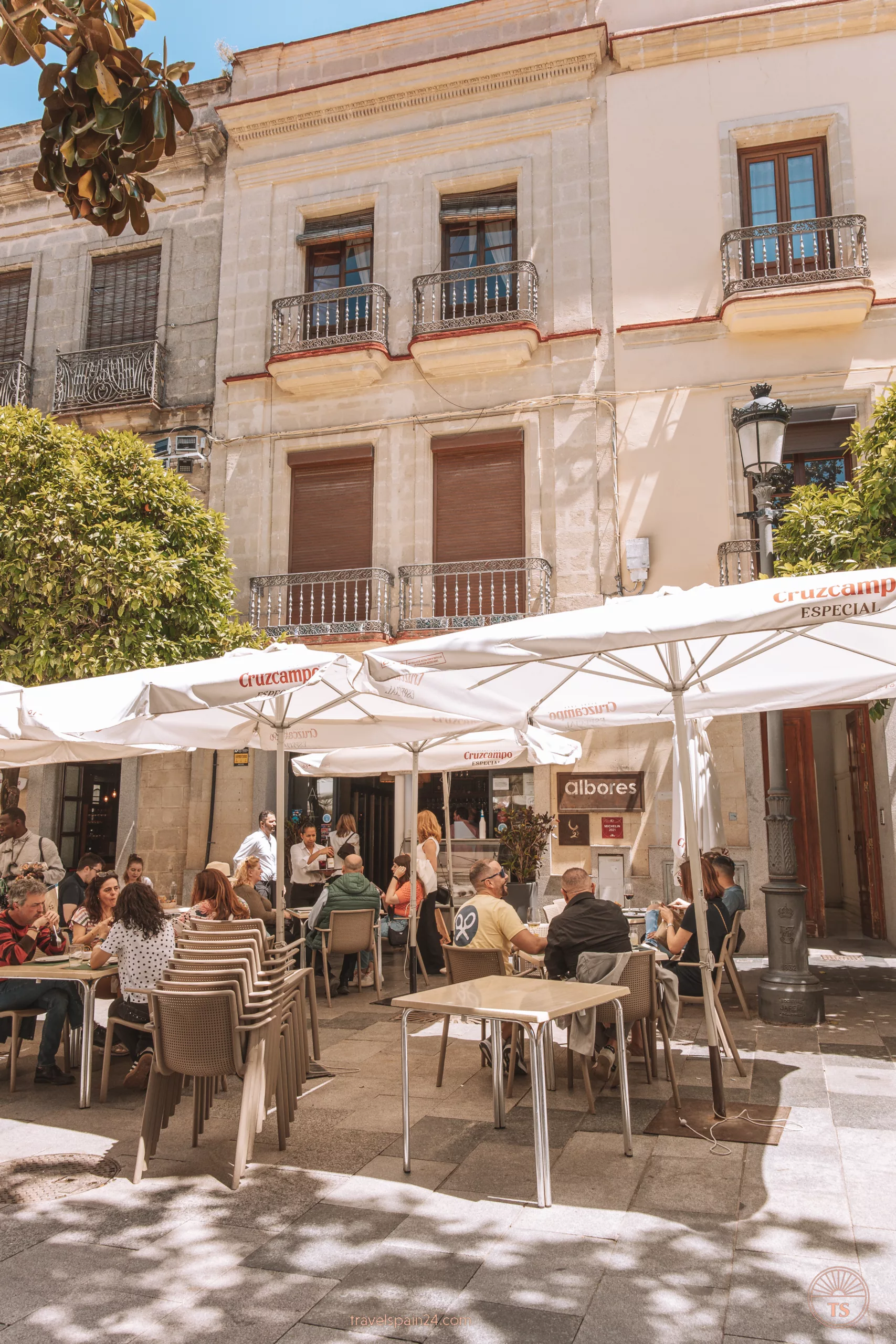 Entrance to Bar & Restaurante Albores in Jerez de la Frontera, with diners enjoying tapas and drinks outside. This image relates to the post by showcasing a favorite dining spot in Jerez de la Frontera.