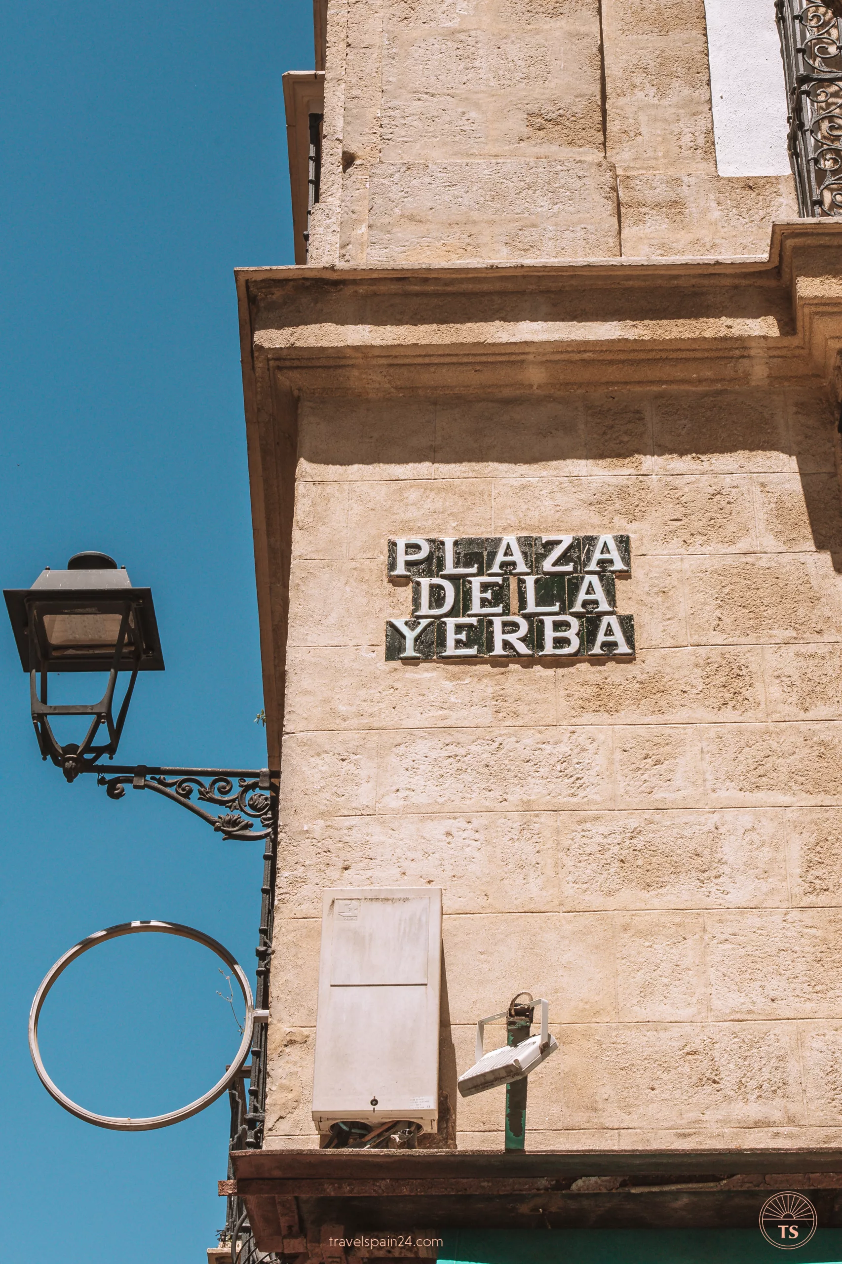 Close-up of the tiles with the name of a plaza in Jerez de la Frontera, emphasizing the traditional Spanish ceramic artistry. This image relates to the post by showcasing the cultural details of Jerez de la Frontera.