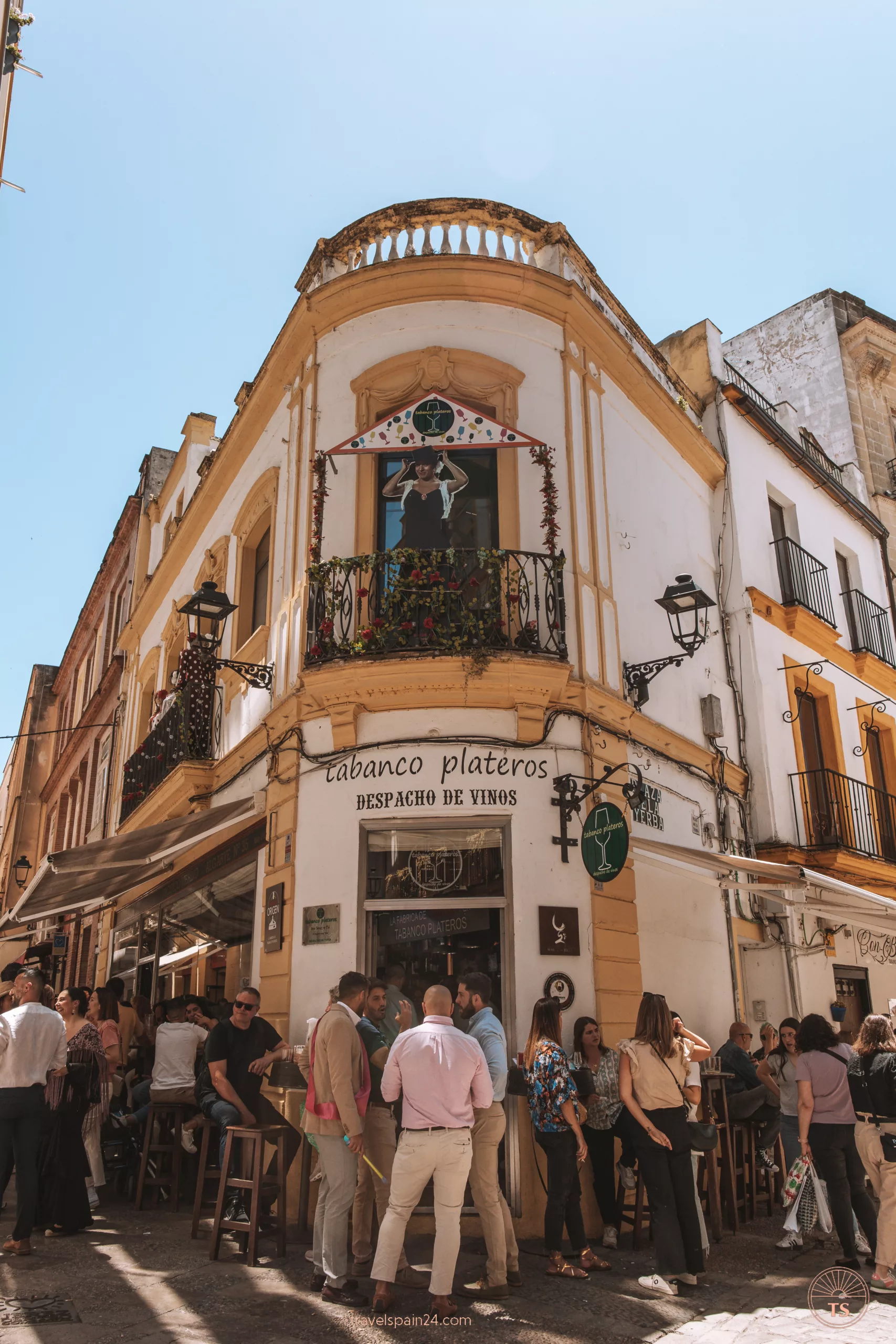 Entrance to Tabanco Plateros in Jerez de la Frontera, with people enjoying tapas and drinks outside. This image relates to the post by highlighting a popular spot for local cuisine in Jerez de la Frontera.