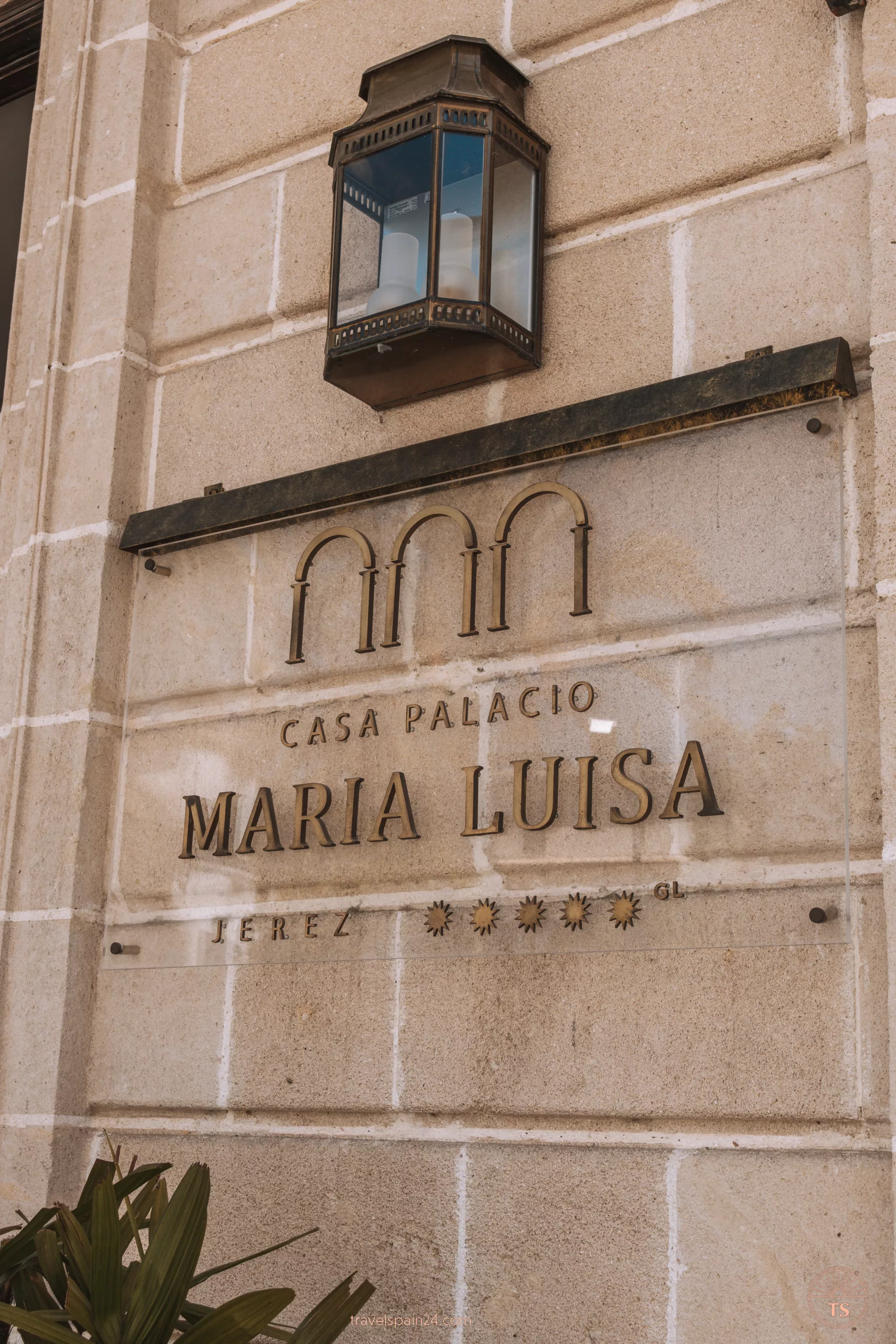Close-up of the hotel sign for Casa Palacio María Luisa in Jerez de la Frontera, highlighting the elegant lettering. This image relates to the post by showcasing a recommended place to stay in Jerez de la Frontera.