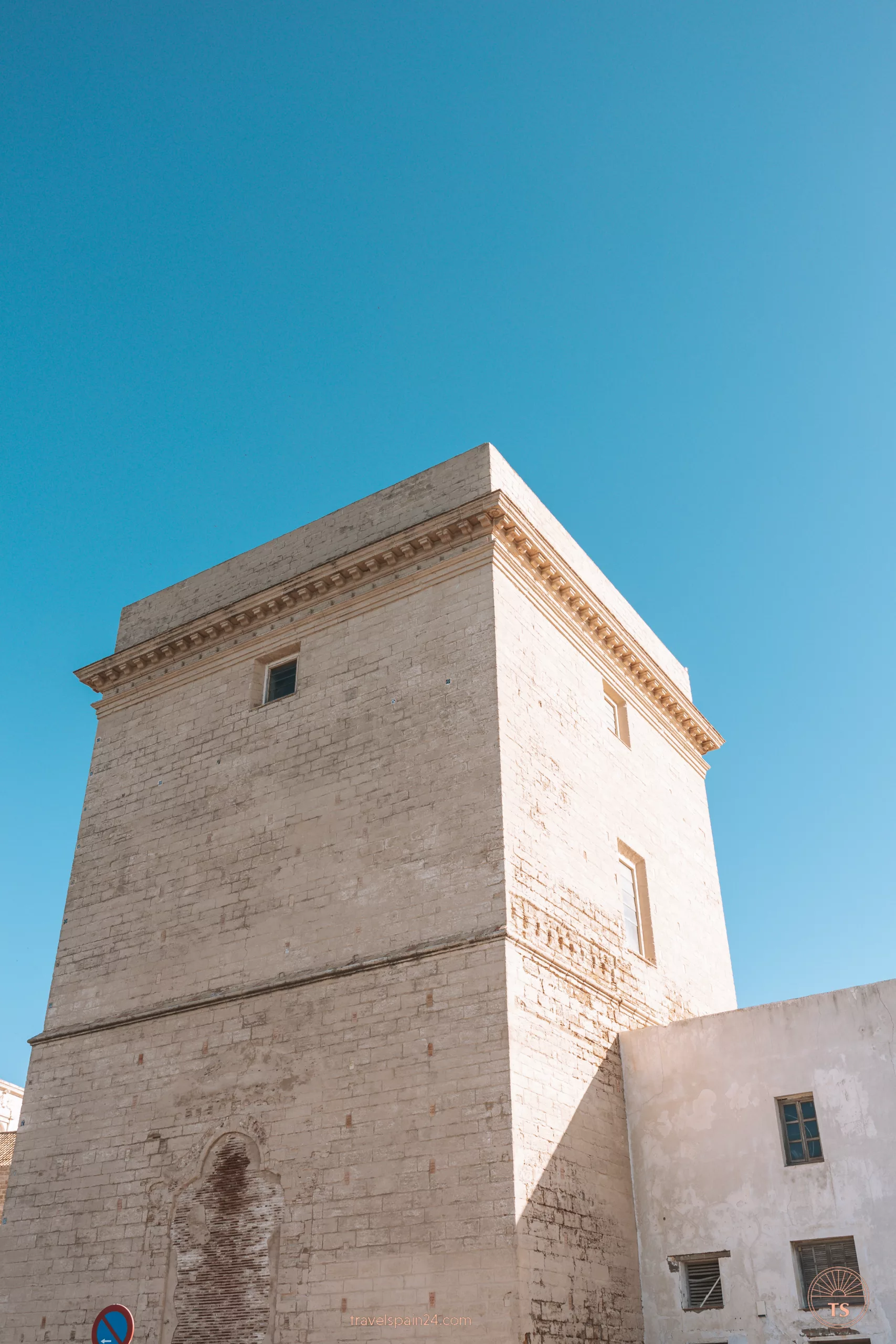 Close-up of Torre del Sagrario in Cadiz, showcasing intricate details of its historic architecture. This tower is one of the Cadiz highlights, reflecting the city's rich cultural heritage.
