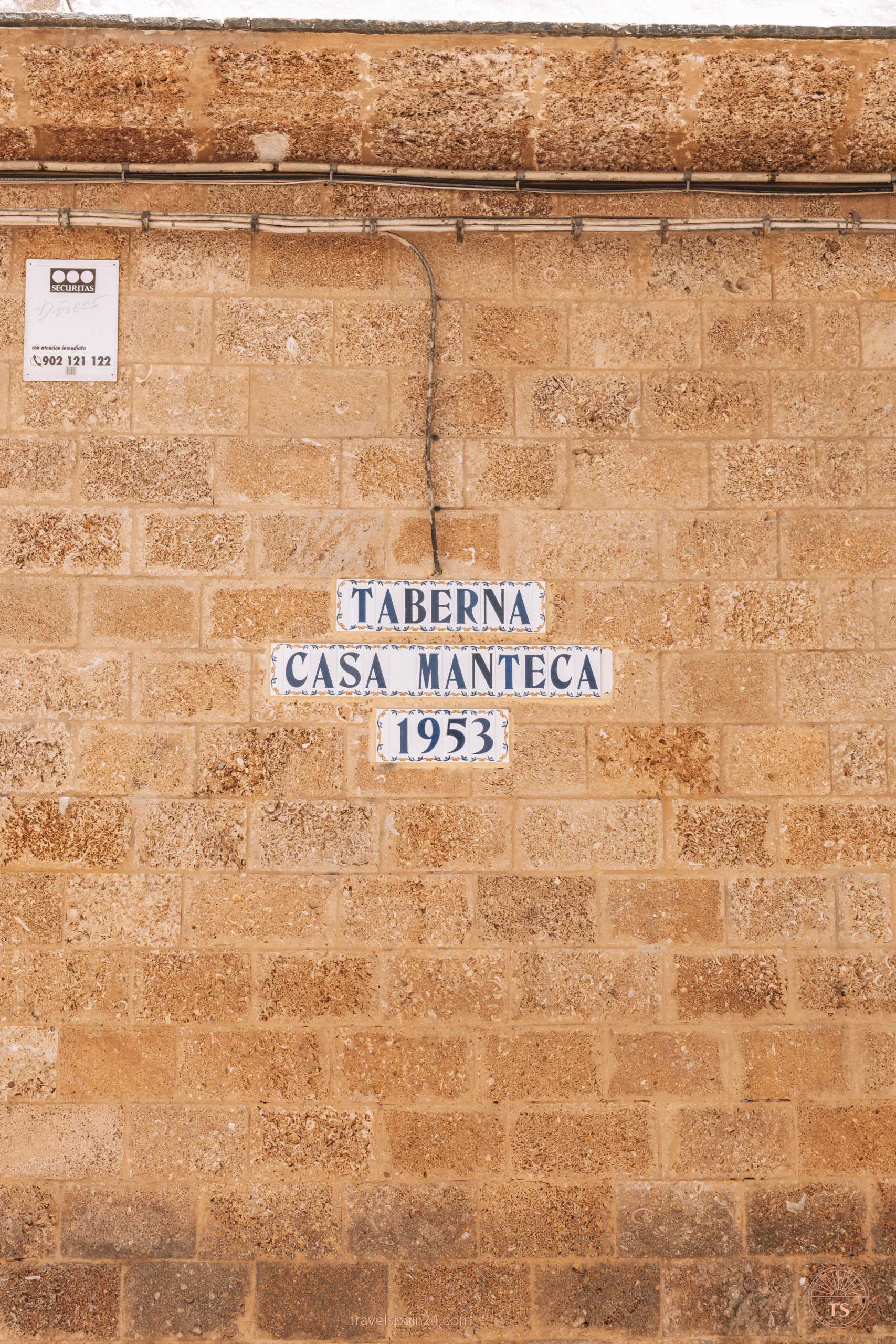 Close-up of the tiles displaying the name of Taberna Casa Manteca on the wall in Cadiz. This detail is one of the Cadiz highlights, showcasing the traditional charm of the local dining scene.
